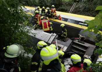Emergency workers on an upturned carriage