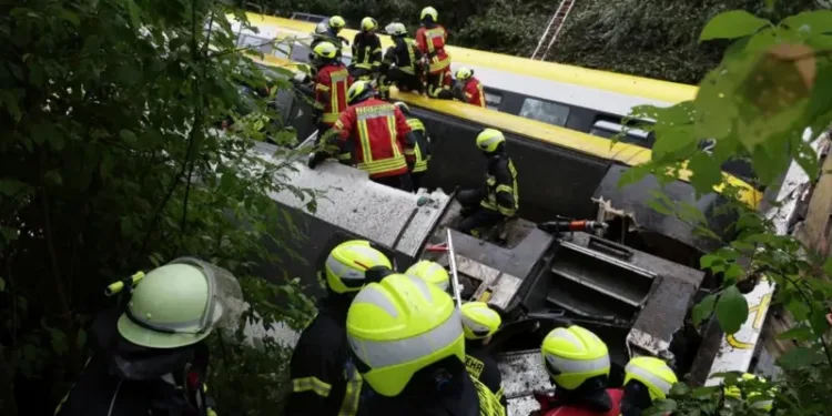 Emergency workers on an upturned carriage