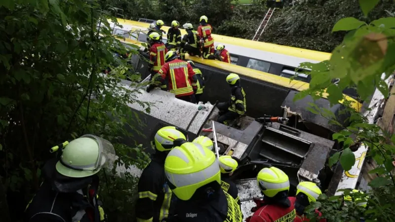 Emergency workers on an upturned carriage
