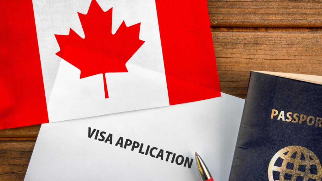 Visa application form, passport and flag of Canada