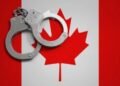 handcuff and canada flag