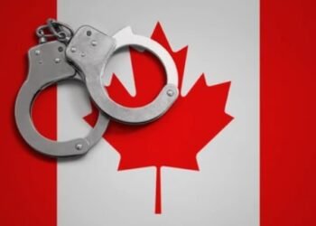 handcuff and canada flag