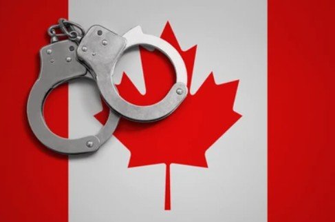 handcuff and canada flag
