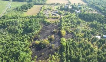Firefighters contained a large brush fire in Ottawa's rural area yesterday
