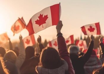 crowd-hands-waving-flags-of-canada
