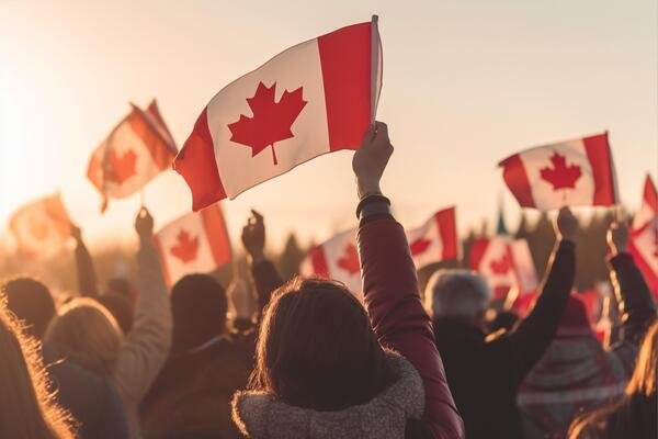 crowd-hands-waving-flags-of-canada