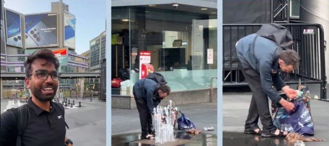 man washing clothes under Toronto fountain