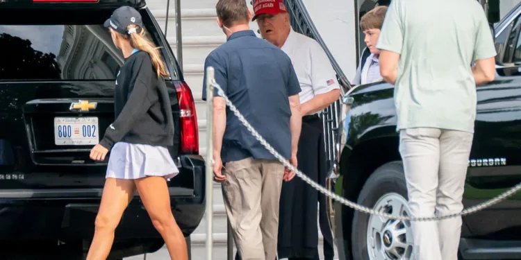 U.S. President Donald Trump departs the White House this morning with his grandchildren,
