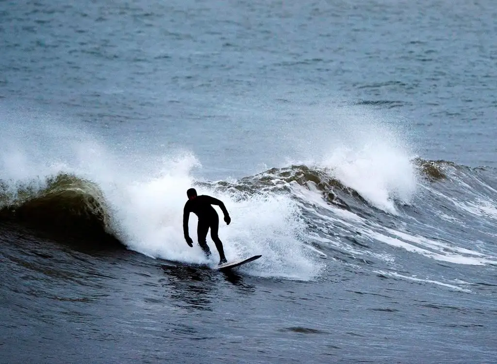 Nova Scotians take advantage of big swells caused by Hurricane Erin.