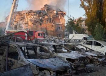 a group of cars in a pile of debris
