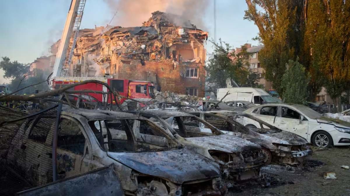 a group of cars in a pile of debris
