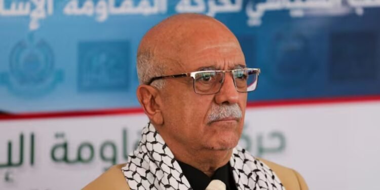 a man in glasses and a scarf