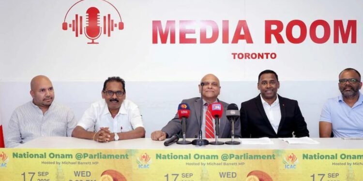 a group of men sitting at a table with microphones