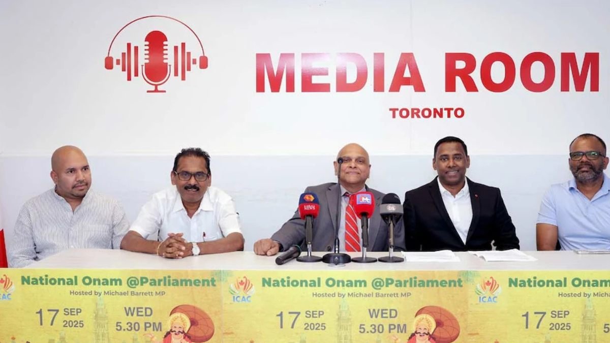 a group of men sitting at a table with microphones