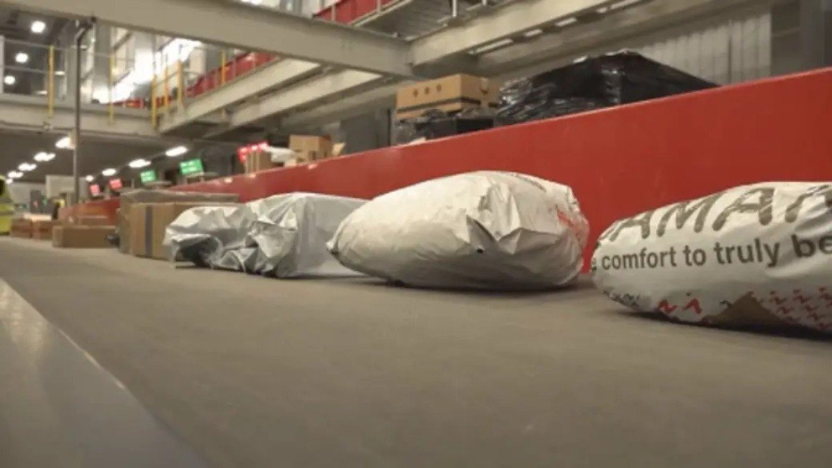 a group of bags on a conveyor belt