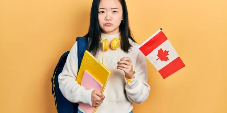 young-chinese-girl-holding canada flag