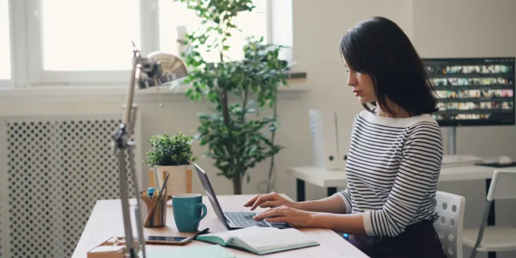student working in laptop