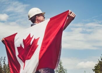 men with canada flag