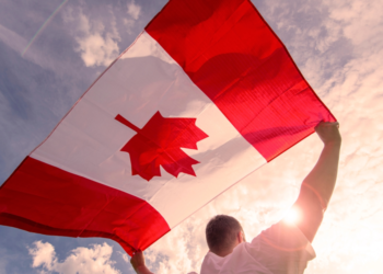 men with canadian flag