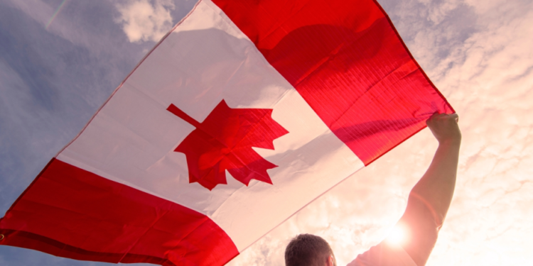 men with canadian flag