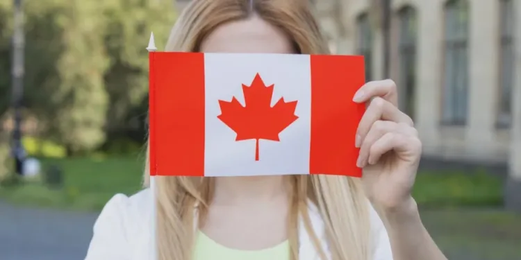 girl holding canada flag