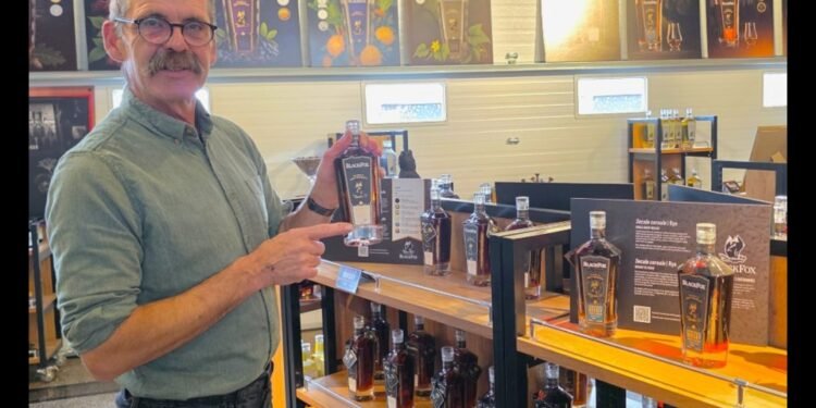 John Cote shows off their award-winning whisky