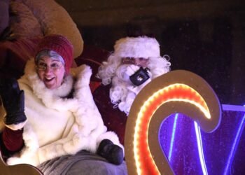 Santa and Mrs. Claus wave to the crowd