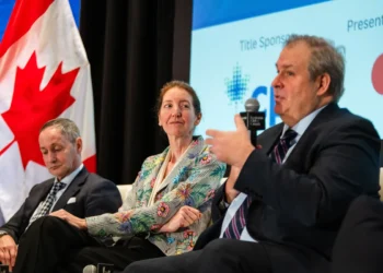 Stefane Marion, left, Beata Caranci and Jean-Francois Perrault during an Economic Club of Canada