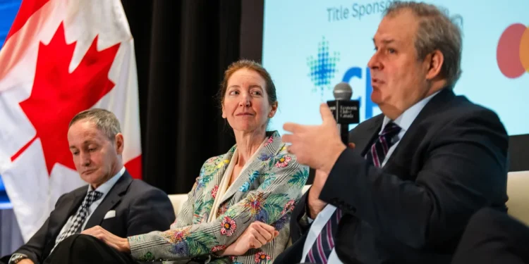 Stefane Marion, left, Beata Caranci and Jean-Francois Perrault during an Economic Club of Canada