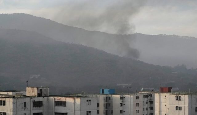 Smoke rises from Fort Tiuna, the main military garrison in Caracas