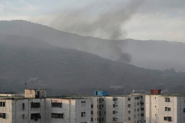 Smoke rises from Fort Tiuna, the main military garrison in Caracas