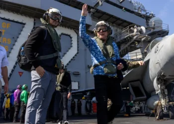 US Special Envoy to the Middle East Steve Witkoff waves on board aircraft carrier the USS Abraham Lincoln in the Arabian Sea