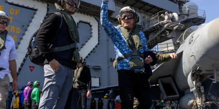 US Special Envoy to the Middle East Steve Witkoff waves on board aircraft carrier the USS Abraham Lincoln in the Arabian Sea