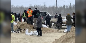 Piles of sand are pictured at Peguis First Nation
