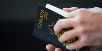 The new Canadian passport is unveiled at an event at the Ottawa International Airport in Ottawa on Wednesday, May 10, 2023. THE CANADIAN PRESS/Sean Kilpatrick