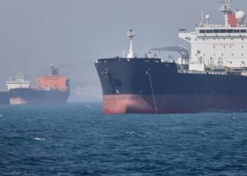 Oil tankers sit at anchor offshore in the Strait of Hormuz off Bandar Abbas
