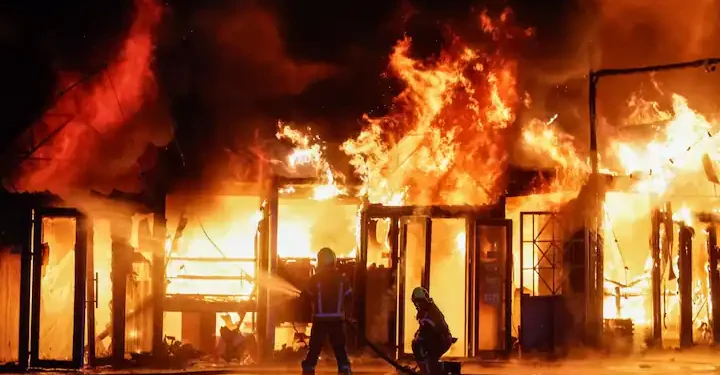 Firefighters work at a site of a book market hit by a Russian missile strike, amid Russia's attack on Ukraine, in Kyiv region, Ukraine. Photo: Reuters