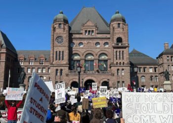 People take part in a rally over OSAP cuts outside Queen's Park in Toronto on Wednesday March 4, 2026. THE CANADIAN PRESS/Allison Jones