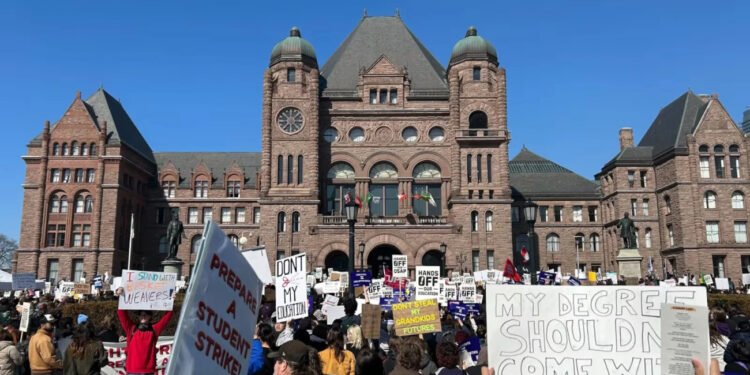 People take part in a rally over OSAP cuts outside Queen's Park in Toronto on Wednesday March 4, 2026. THE CANADIAN PRESS/Allison Jones