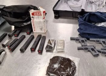 A Calgary man is facing dozens of charges after two loaded handguns were allegedly found in his possession after he fled from officers in a stolen vehicle. (CPS handout)