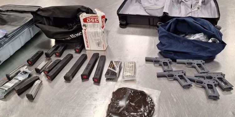 A Calgary man is facing dozens of charges after two loaded handguns were allegedly found in his possession after he fled from officers in a stolen vehicle. (CPS handout)