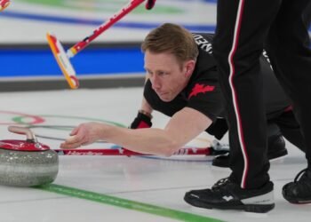Canada's Marc Kennedy in action during the men's curling round robin session against Sweden, at the 2026 Winter Olympics, in Cortina d'Ampezzo, Italy, Feb. 13, 2026.