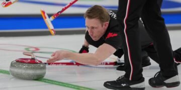 Canada's Marc Kennedy in action during the men's curling round robin session against Sweden, at the 2026 Winter Olympics, in Cortina d'Ampezzo, Italy, Feb. 13, 2026.