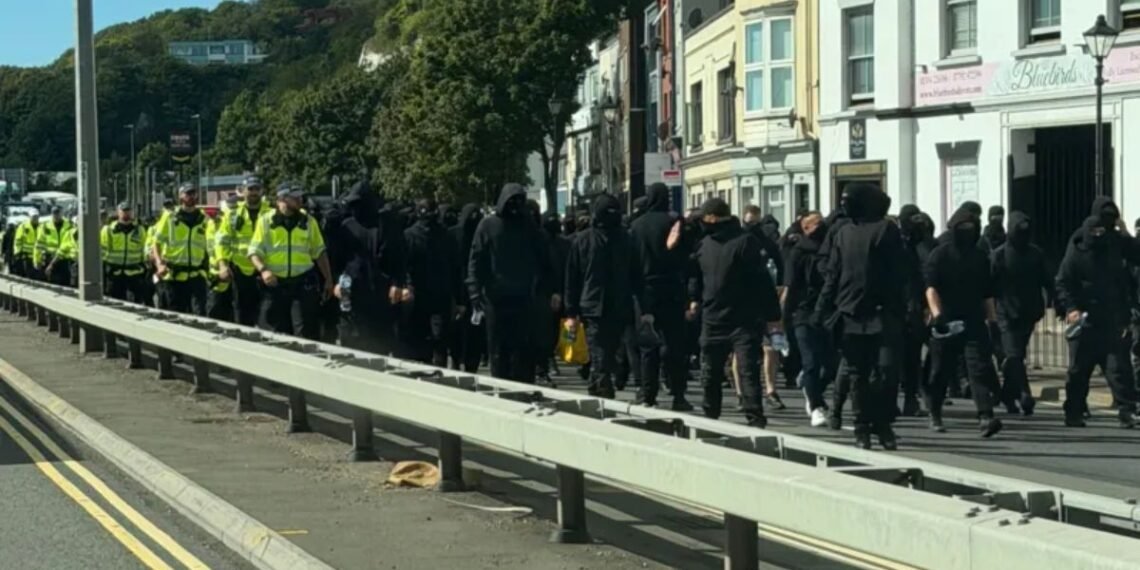 Hundreds of masked men blocked roads and prevented access to the Port of Dover on Saturday
