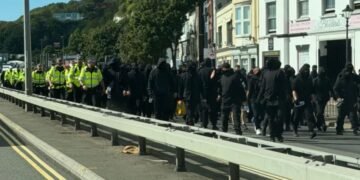 Hundreds of masked men blocked roads and prevented access to the Port of Dover on Saturday