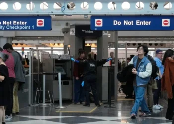 Travellers go through TSA security check at O'Hare International Airport, Saturday, March 21, 2026, in Chicago. (AP Photo/Kiichiro Sat0)