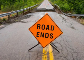 Warning signage is seen in front of a washed out road near Marble Mountain