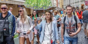 Tourists on a free walking tour with a local guide