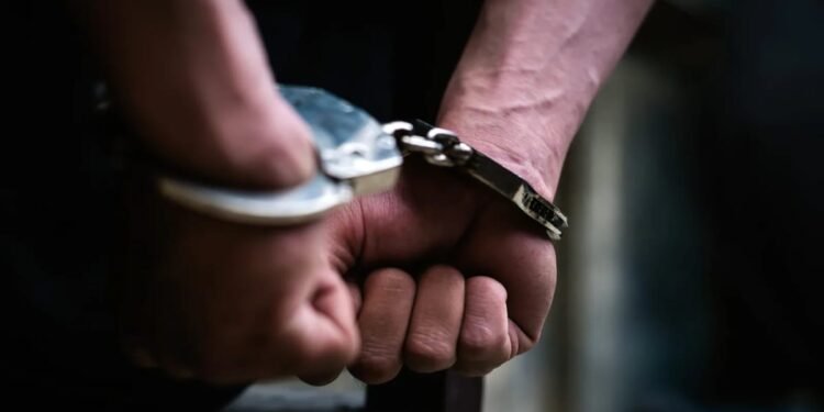 Person in handcuffs during an arrest