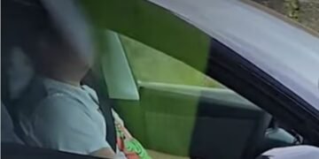 The BCHP says an officer passed a sleeping driver in a dark-coloured Tesla on Aug. 27 as it sped down the Trans-Canada Highway through Langley. (RCMP)